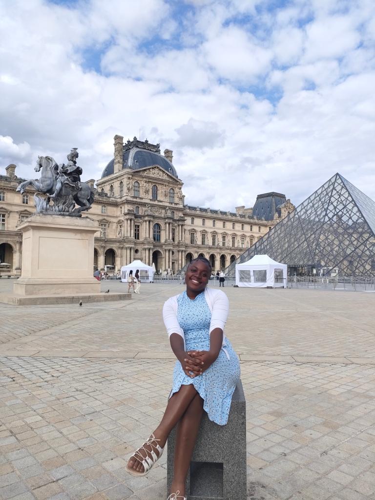 Martha sitting outside the Louvre Museum, sightseeing Martha sitting outside the Louvre Museum, sightseeing